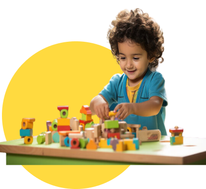 Playschool student playing with blocks
