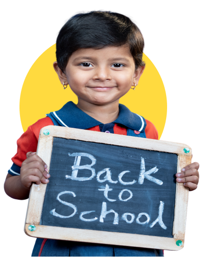 Primary student with back to school board